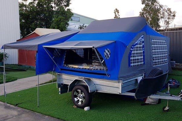 Photo of a trailer tent setup and ready to use